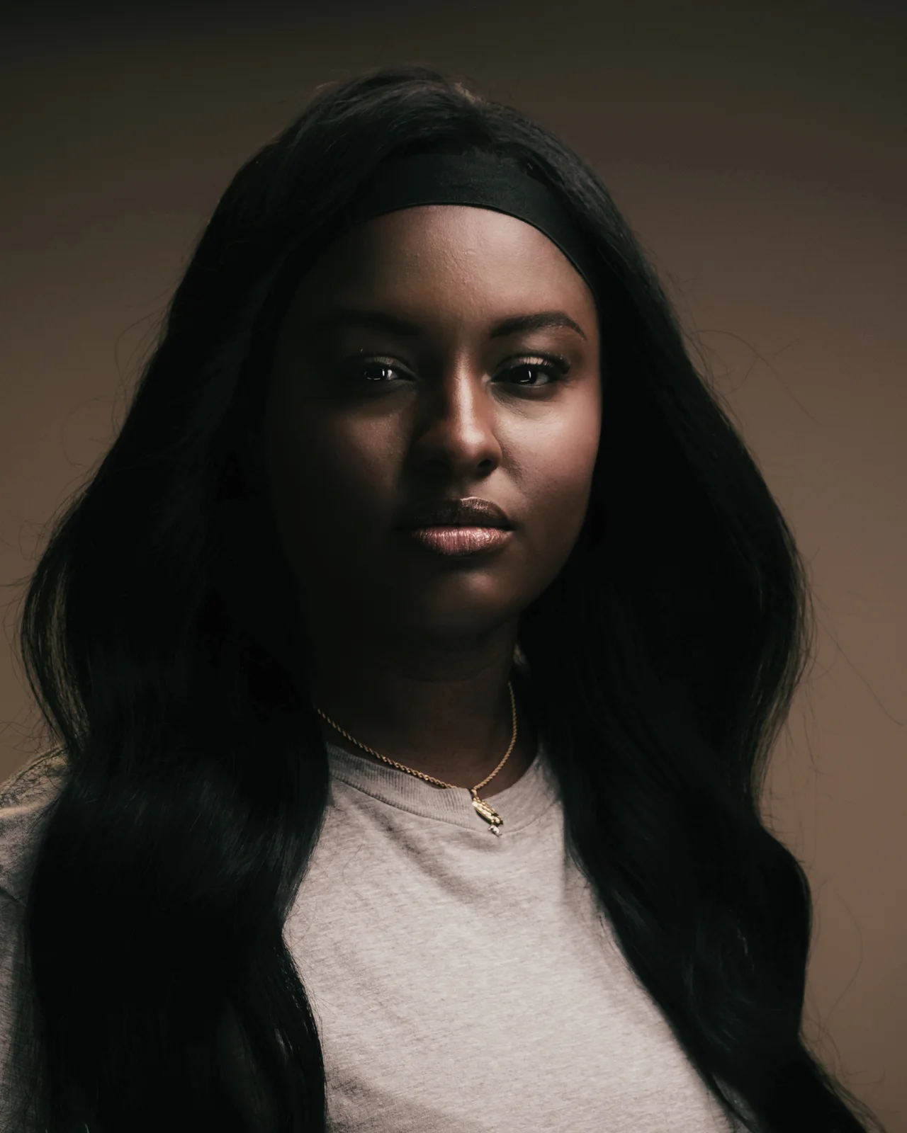 Professional studio portrait with a warm background